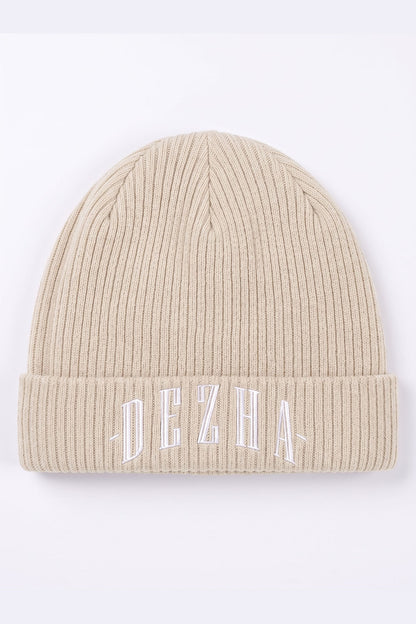 DEZHA BEANIE aus 100 % Baumwolle mit doppellagigem Strick, leichtem Gewebe und klassischem Umschlagdesign.